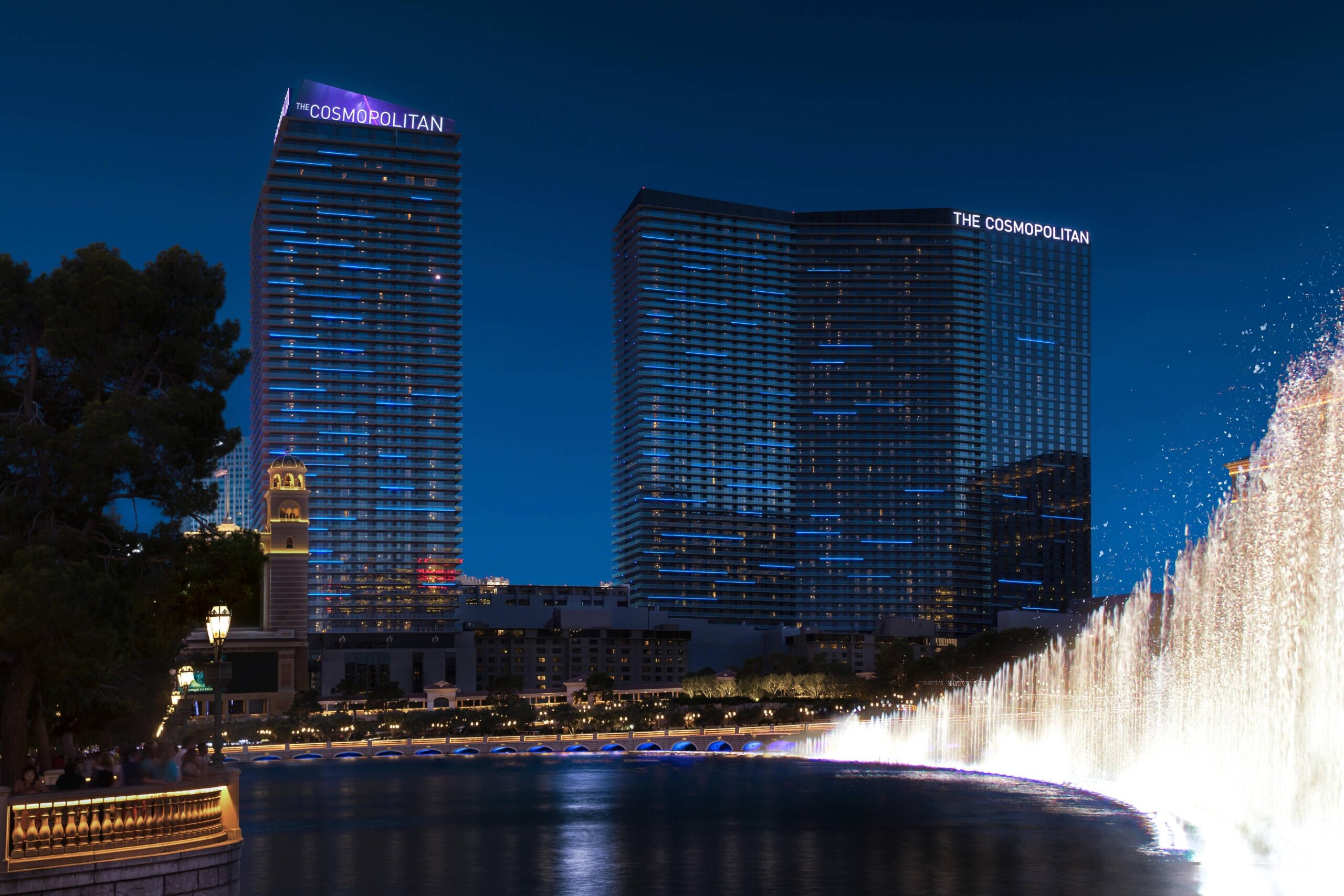 The Cosmopolitan Fountains exterior with both towers lit in blue