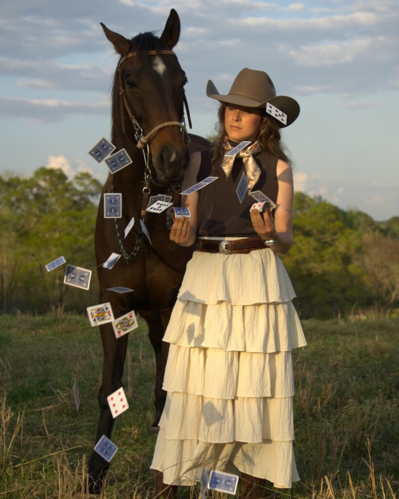 Lady with her horse playing with cards