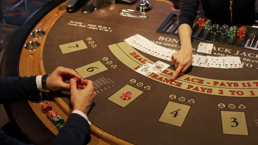 Player sitting at the blackjack table in a casino