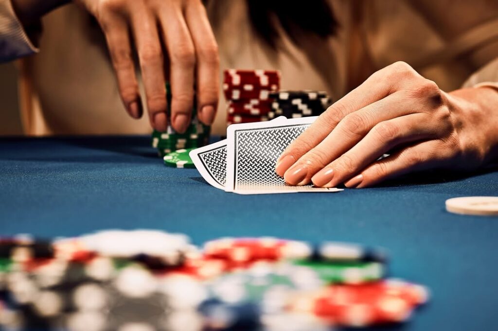COPAG playing cards lady at the poker table getting ready to bet