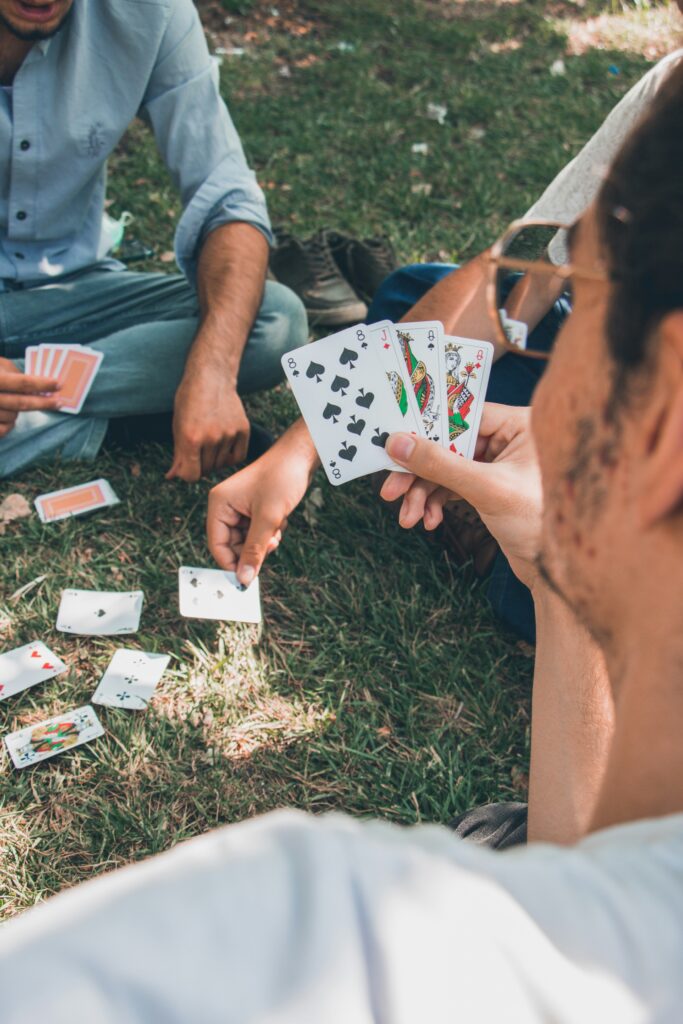 Friends playing cards at the park